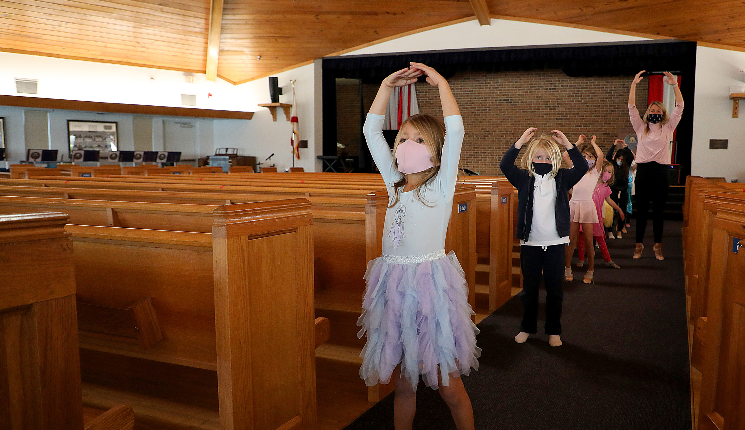 students doing a dance in the chapel at school
