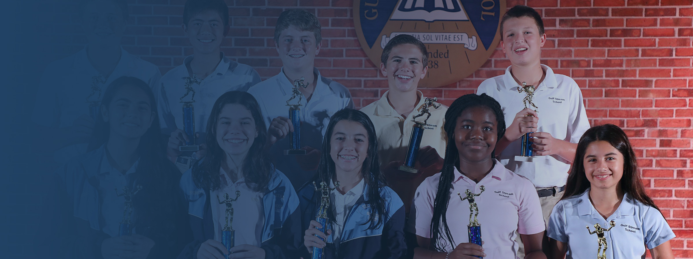 private school students with trophies